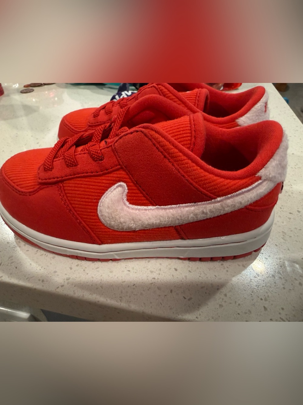 Nike Kids Red Sneakers with White Fuzzy Swoosh
